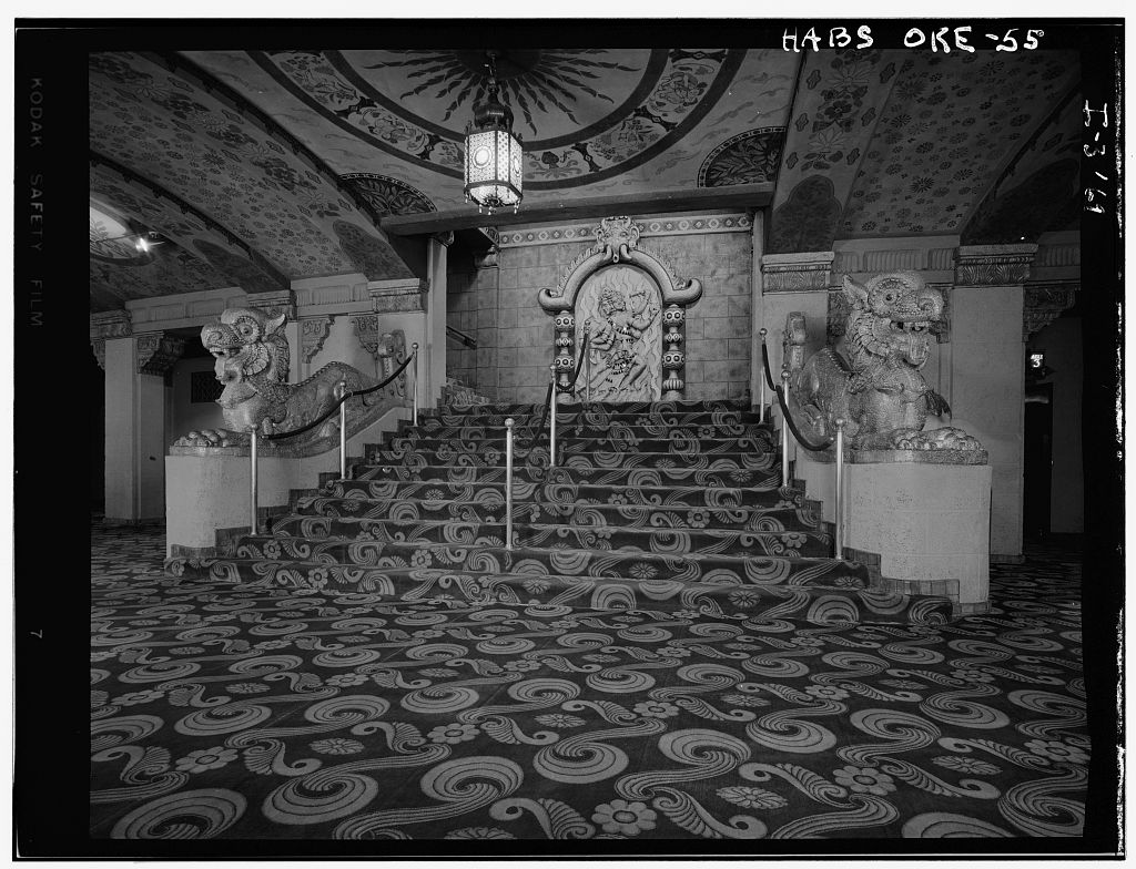 Chinese dragon flanked stairs inside Khmer Revival lobby of Portland's Oriental Theater.